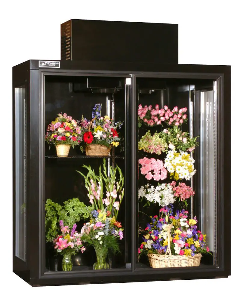 Custom floral cooler with glass shelves and side windows for enhanced visibility