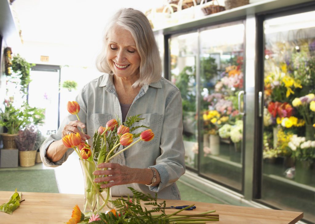 Female florist arranging flowers