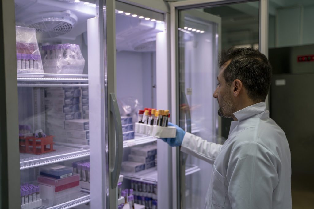 A scientist reviews samples in the custom scientific freezer